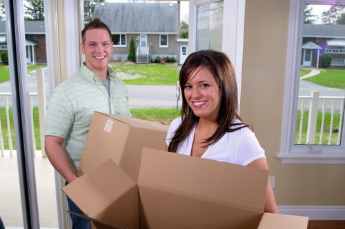 Workers separating recyclable items before disposal