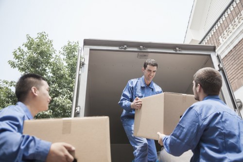 Workers sorting items for recycling and reuse in a local removal