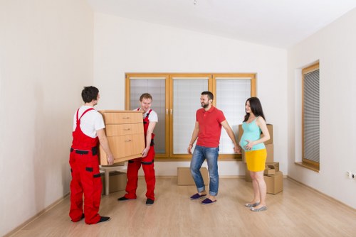Professional moving team handling furniture carefully