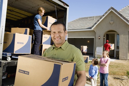 Satisfied customer finalizing booking for Swiss Cottage moving service